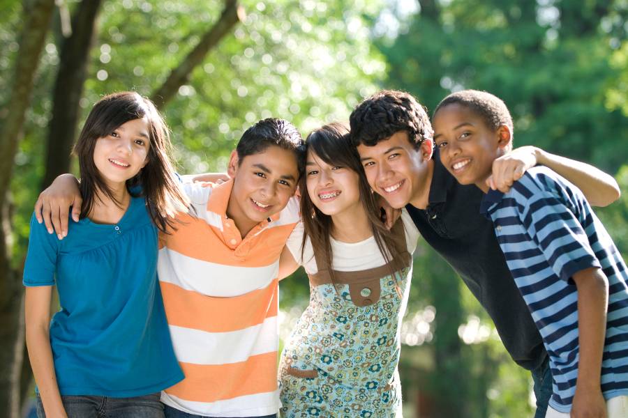 Teens smiling together